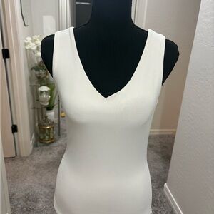 Vintage Cache white bodycon tank top with deep v-neckline. Size M